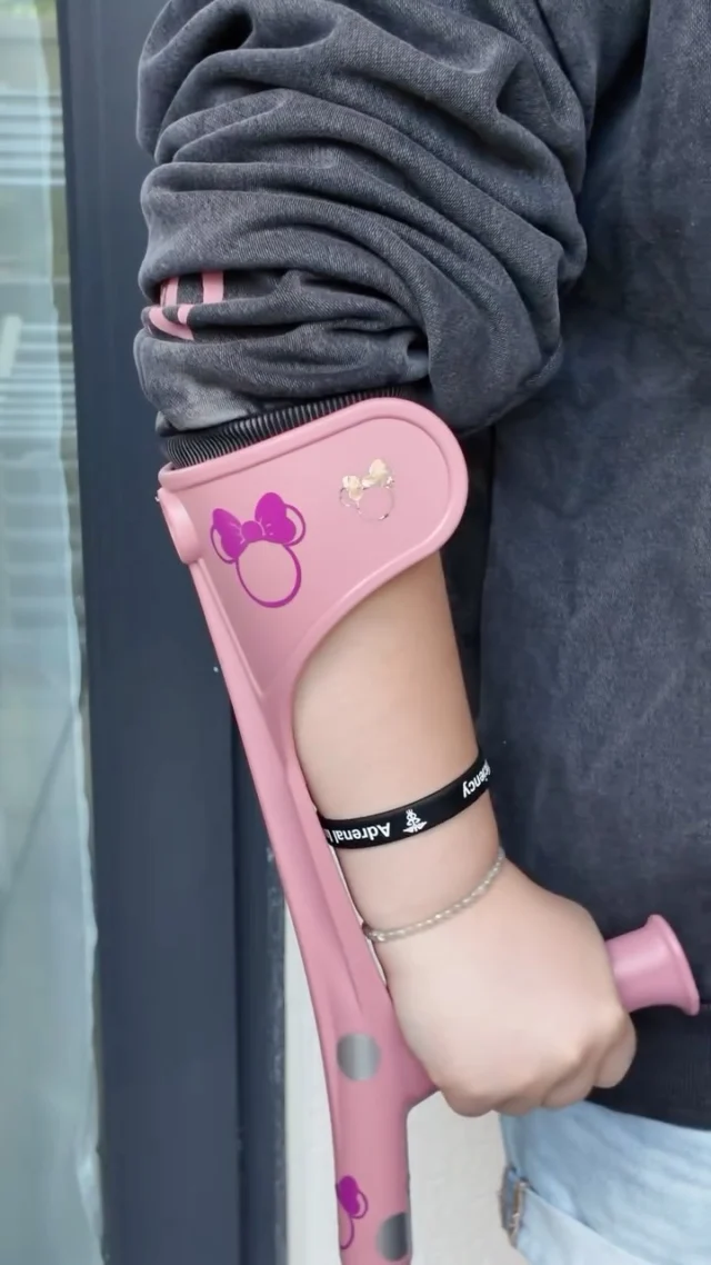 My countdown has officially begun! Gearing up for a trip to see a mouse in Paris ✨@cakeeeeess time to get out your passport 👀VD: A white woman, using her pink crutches, with a close up short of them being decorated with spots and Minnie Mouse. The next clip is of her looking over her shoulder wearing Disney princess ears and a Disney themed top. The final clip is her holding the ears and smiling. Her top reads ‘Disneyland’.
