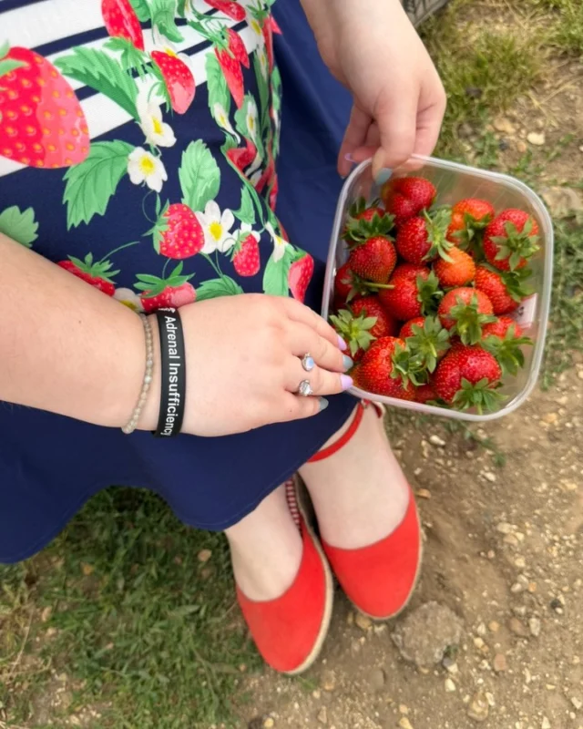 AD: Just call me Strawberry Shortcake 🍓As a certified autumn girlie, my favourite part of summer is categorically strawberries. Bring on Sunflowers and pumpkin seasons, I'm ready.AD Gifted: Dress was PR from  @popsyclothing and it's become a summer staple.VD:
Photo 1: A downward short of my red wedges, a skirt with strawberries along the bottom and a punnet of freshly picked berries.
Photo 2: Imali, a white woman with brown hair wearing a white dress, with navy blue stripes and strawberries along the bottom.
Photo 3: Me, hugging an enormously slightly leaning tree.
Photo 4: Me, trying to elegantly eat a strawberry (failing) and you can see the strawberry plants behind me.