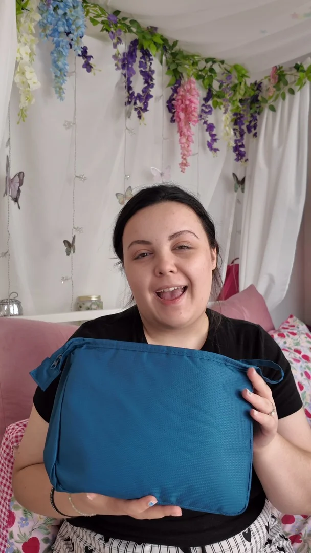 Travelling with a stoma | DLP Edition
It's been super easy to order my supplies well in advance of the trip from @coloplast.uk and get everything organised so that I am  ready for going to Paris!VD: A white woman, who is wearing comfy clothes (because she packed just about everything else that she owns haha) and showing you her stoma bag travel set up in a blue travel bag.